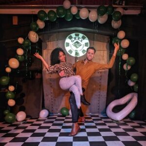 Two samba dances posing in front of a heart shaped balloon arrangement at Pagode, Canary Wharf