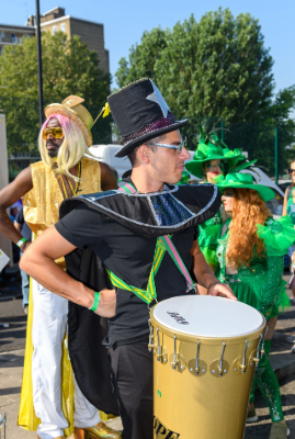 Carnival 2019 - Dummer dressed in black with large yellow surdo drum - Copyright Brian Guttridge