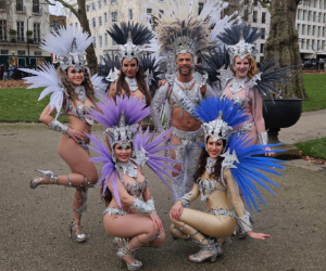Dancer Group with Full feathered costumes on New Years Day Parade