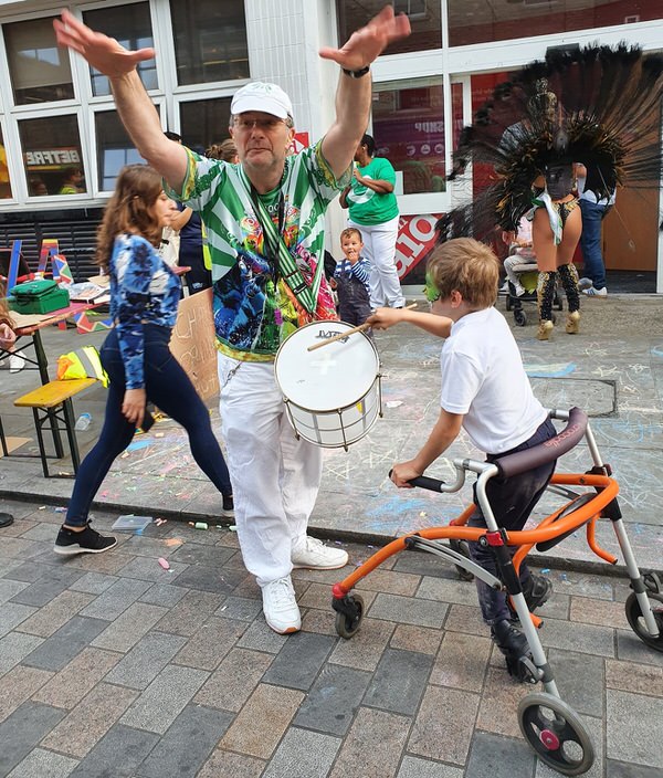 Waterloo Carnival 2021 Mestre Mags with a disabled boy leading the bateria playing Hepinique