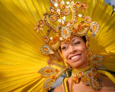 Smiling woman with yellow feather costume