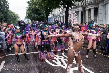 Carnival 2015 - Samba dancers with one at the front presenting her troup - Copyright Brian Guttridge