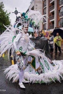 Carnival 2015 -Flag bearers wearing white feathered costumes - Copyright Brian Guttridge