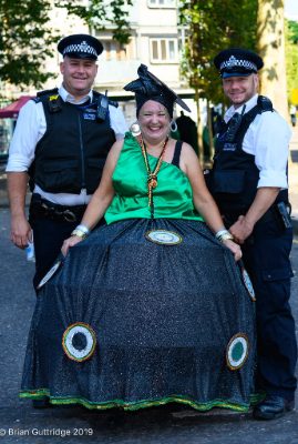 Carnival 2019 - Baiana and police standing smiling at camera - Copyright Brian Guttridge