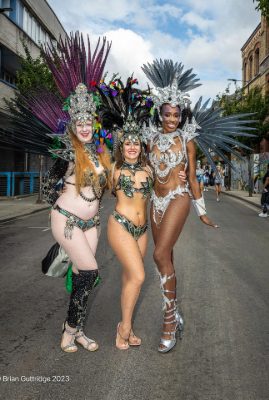 Carnival 2023 - Three dancers posing in full samba costumes - Copyright Brian Guttridge