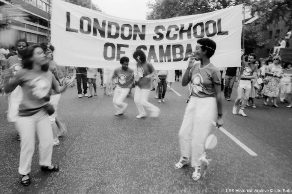 Carnival 1984 LSS Banner with people dancing around - Copyright Lito Soto