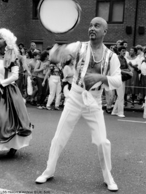 Carnival 1984 man Spinning tamborine in air in black and white - Copyright Lito Soto